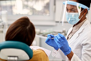 Patient talking to dentist during dental exam