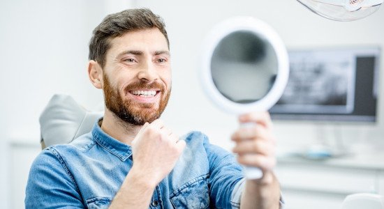 Man smiling after receiving cosmetic dentistry